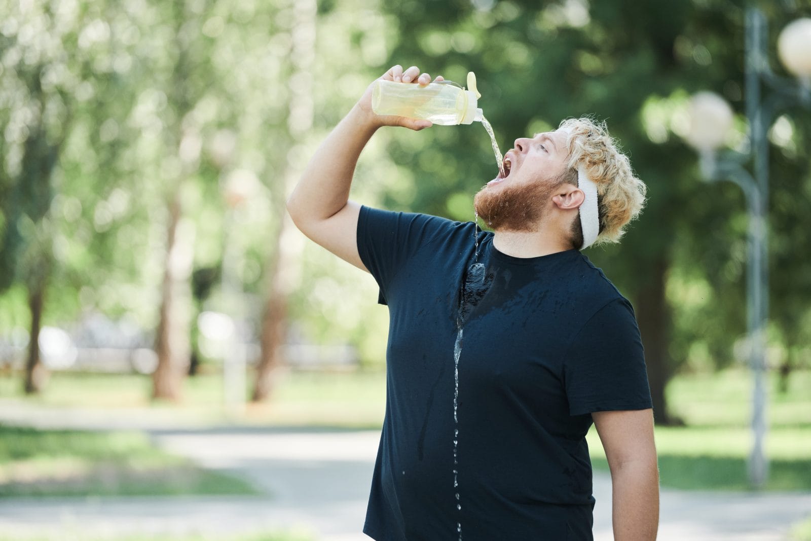 Man drinking water outdoors 1168646