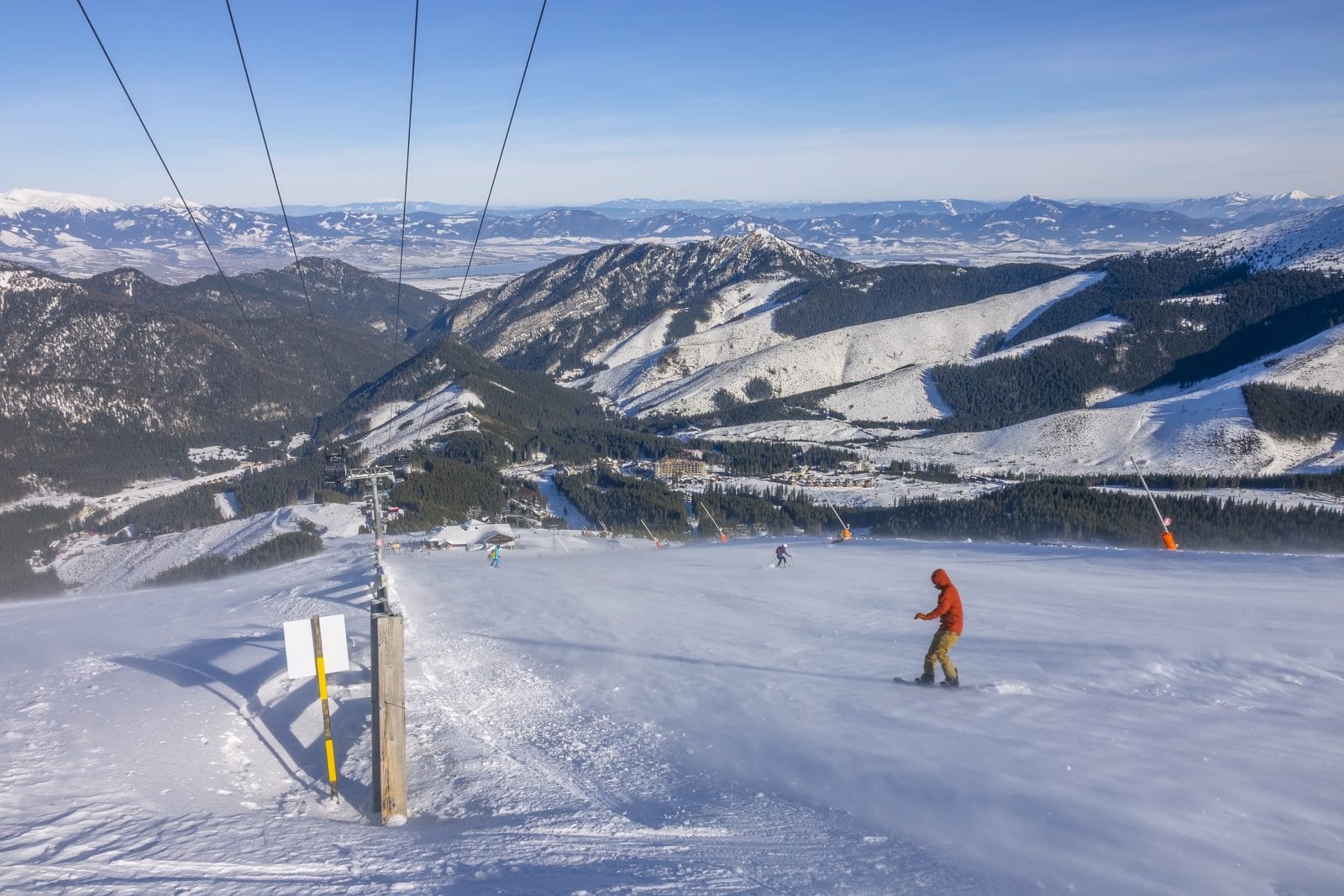 Snowboarder on a sunny ski slope 1091408