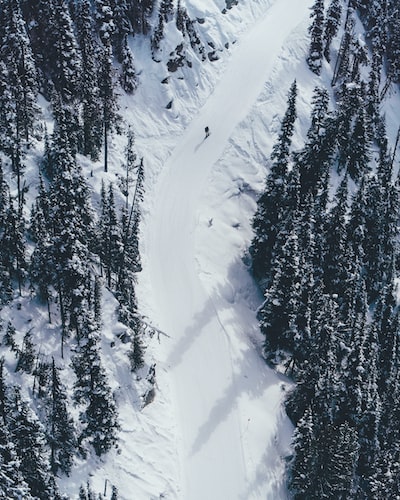 aerial photography of person skiing on snow mountain